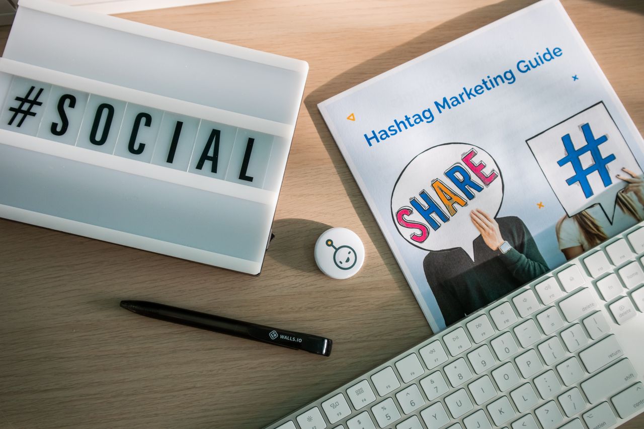 hero-img A desktop setup with social media marketing essentials including a keyboard, lightbox, and guide.